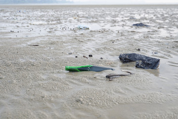 Lok Kawi, Kota Kinabalu, Sabah, Malaysia - September 08, 2019: There is a lot of rubbish left in Lok Kawi Beach. This rubbish are dumped into the sea and washed away to this beach.