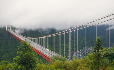 aerial view of the Aizhai Bridge in a foggy and cloudy day in west Huhan, China.
