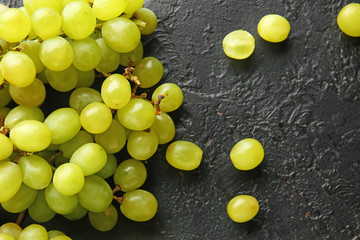 Ripe sweet grapes on dark background