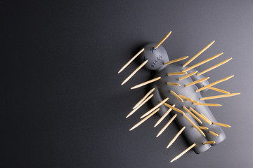 .Voodoo Doll on a black background with dramatic lighting.