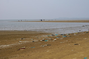 Lok Kawi, Kota Kinabalu, Sabah, Malaysia - September 08, 2019: There is a lot of rubbish left in Lok Kawi Beach. This rubbish are dumped into the sea and washed away to this beach.