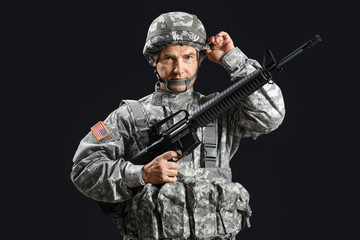 Fototapeta premium Mature male soldier on dark background