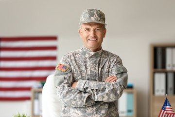 Mature male soldier in headquarters building - obrazy, fototapety, plakaty