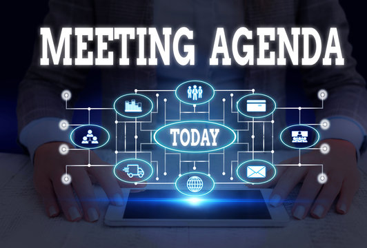 Writing note showing Meeting Agenda. Business concept for items that participants hope to accomplish at a meeting Woman wear formal work suit presenting presentation using smart device
