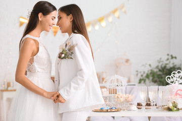 Beautiful lesbian couple during wedding ceremony