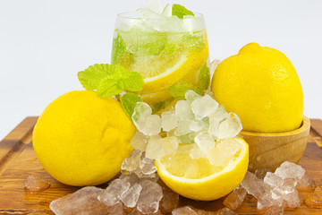 Fresh Fruit Yellow lemon in glass on wood for hot summer days and good for health
