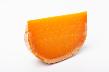 french cow's milk cheese mimolette isolated on white