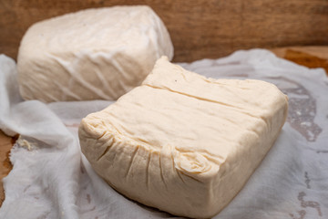 Tahu or tofu made from fermented soybean milk, a vegan friendly protein source 
