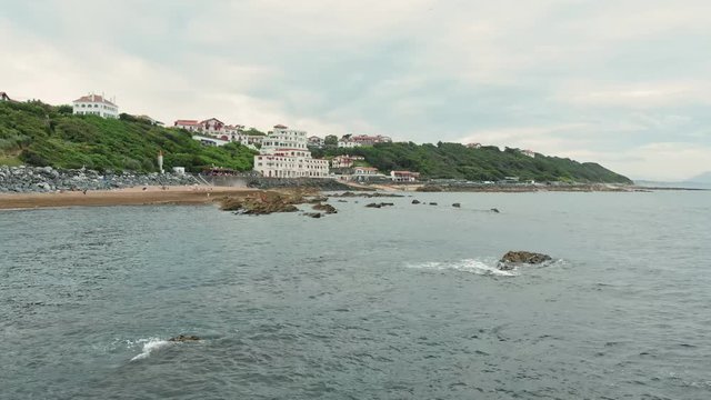 Aerial Shot of Guethary Beach Resort with Houses and Hotels facing the Ocean - Basque Country South West of France