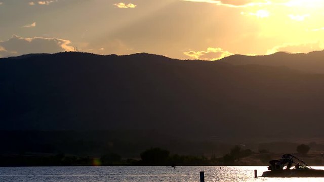 Water sports activities in Boulder Reservoir during sunset