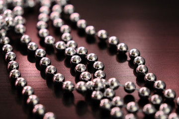 Silver Christmas decoration on a dark wooden background close up
