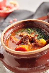 Traditional Tasty Hungarian Goulash Soup or Casserole in Ceramic Cookware
