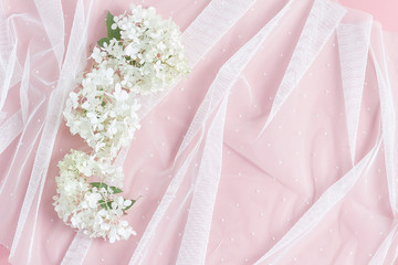 white tulle and beautiful hydrangea flowers. pink table background. feminine wedding, birthday...