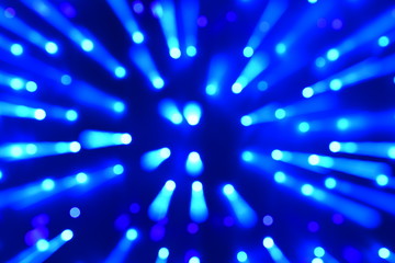 Fototapeta na wymiar Abstract blurred pattern of light in blue tones
