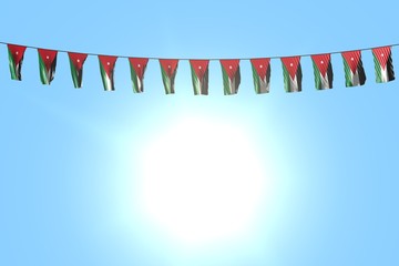 Obraz premium wonderful many Jordan flags or banners hangs on rope on blue sky background - any celebration flag 3d illustration..