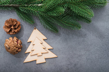 Decor wooden fir tree with branches on a stone background