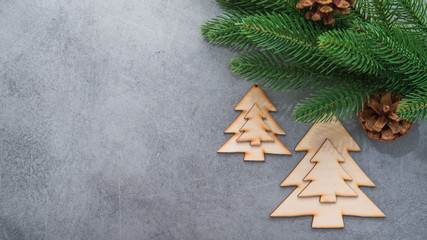Decor wooden fir tree with branches on a stone background