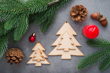 Decor wooden fir tree with branches on a stone background