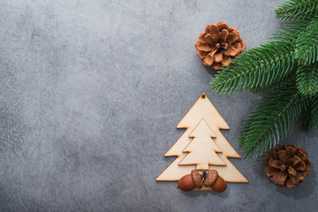 Decor wooden fir tree with branches on a stone background