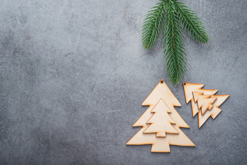 Decor wooden fir tree with branches on a stone background