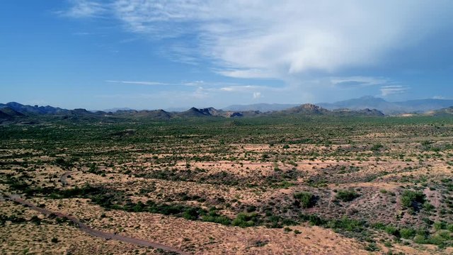 Aerial drone shot flying in desert scenery landscape with blue skies and clouds Apache Junction, Arizona Lost Dutchman State Park