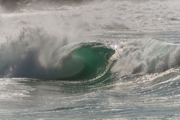 huge wave crashing in hawaii