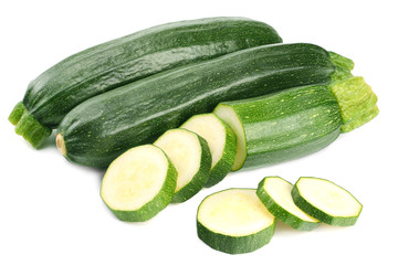 fresh green zucchini with slices isolated on white background