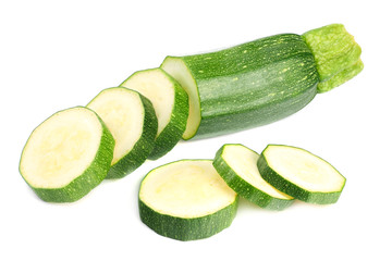 fresh green zucchini with slices isolated on white background