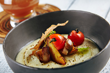 Delicious Mushroom Soup with Garlic and Cherry Tomato