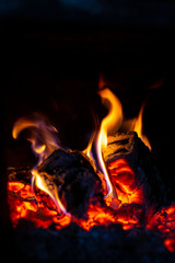 Fire is red in a closed oven on black background. 2019