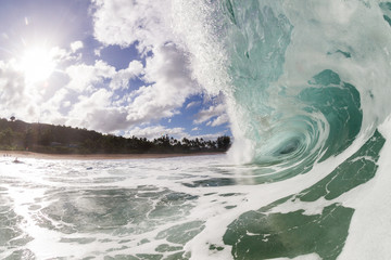 close up wave breaking on the beach in hawaii