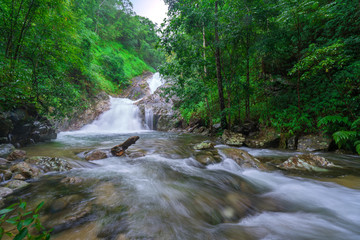 beautiful waterfall in rainforest at National Park, Thailand.