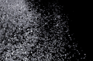 a lot of falling drops on a black background, like heavy rain