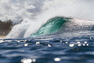 Huge wave breaking at Banzia Pipeline in Hawaii