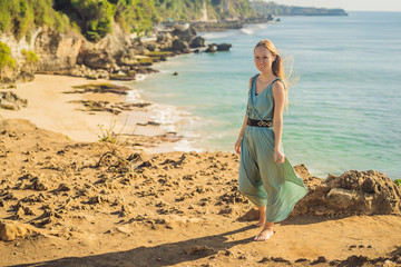 Young woman tourist on Pantai Tegal Wangi Beach, Bali Island, Indonesia. Bali Travel Concept