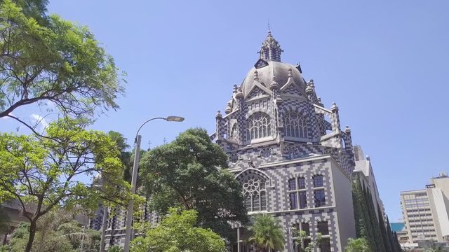 Slow panorama 4k of Plaza Botero and Palacio Uribe in Medellin