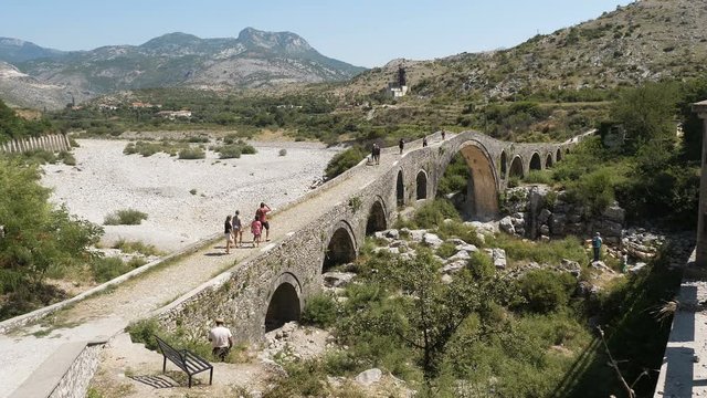 Beautiful view of tourists walkin on  Mesi Bridge, Shkod&euml;r,Albania,August 2019