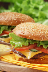 Two fresh hamburgers with vegetables