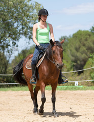 Obraz premium riding girl and horse