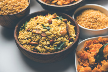 Group of Cornflake and Thick Poha Chivda or Chiwda and Chatpata Masala chana and fried crispy Moong Dal, served in a bowl. selective focus