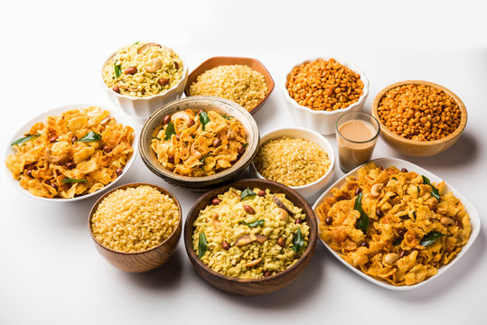 Group of Cornflake and Thick Poha Chivda or Chiwda and Chatpata Masala chana and fried crispy Moong Dal, served in a bowl. selective focus