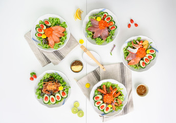 Variety of Salad with Salmon, Maguro, Spider crab,Kani and Seafood set on the table