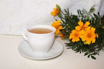 Obraz na płótnie Canvas Delicious tea in a white Cup on a saucer.