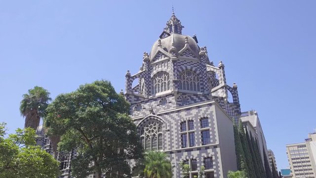Stunning 4k slow moving walking shot of church in Plaza Botero, Medellin