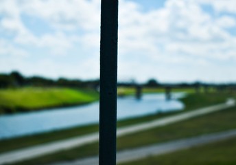 Fototapeta premium Landscape River And Bridge Blue Sky Background