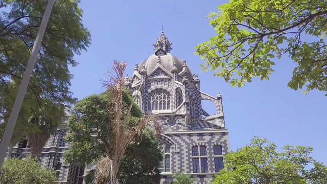 Beautiful slow walking 4k shot of church in Plaza Botero, Medellin