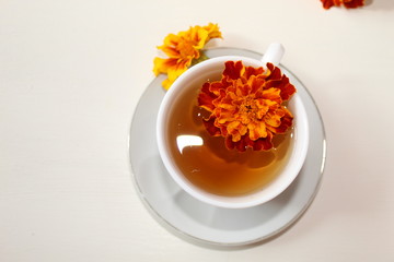 Delicious tea in a white Cup on a saucer.