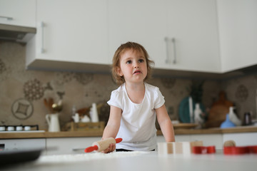 child in kitchen cries and is naughty,
