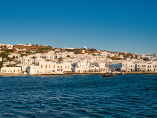 Picturesque seascape with boats and white buildings