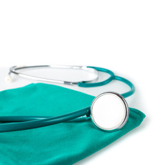 Stethoscope on green cloth in operating room , Stethoscope Concept of medicine and diagnostics.